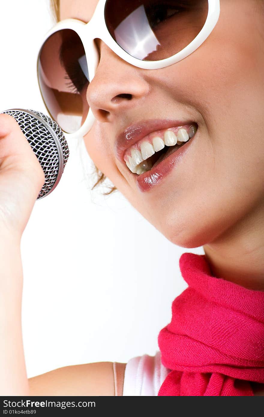 Portrait of a happy singing woman with a microphone. Portrait of a happy singing woman with a microphone