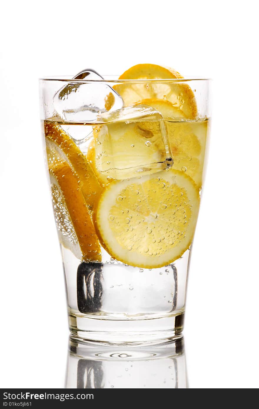 Glass with fizzy liquid and lemon slice. Glass with fizzy liquid and lemon slice