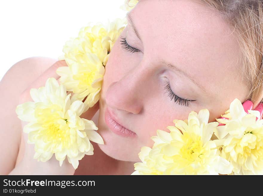 Close-up portrait of beautiful blond girl with yellow flowers. Close-up portrait of beautiful blond girl with yellow flowers