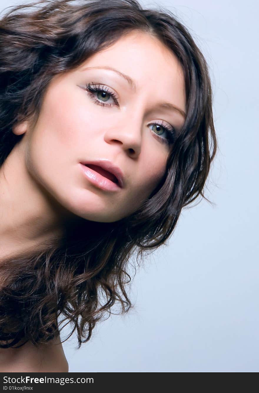 Close-up portrait of a beautiful young brunette. Close-up portrait of a beautiful young brunette