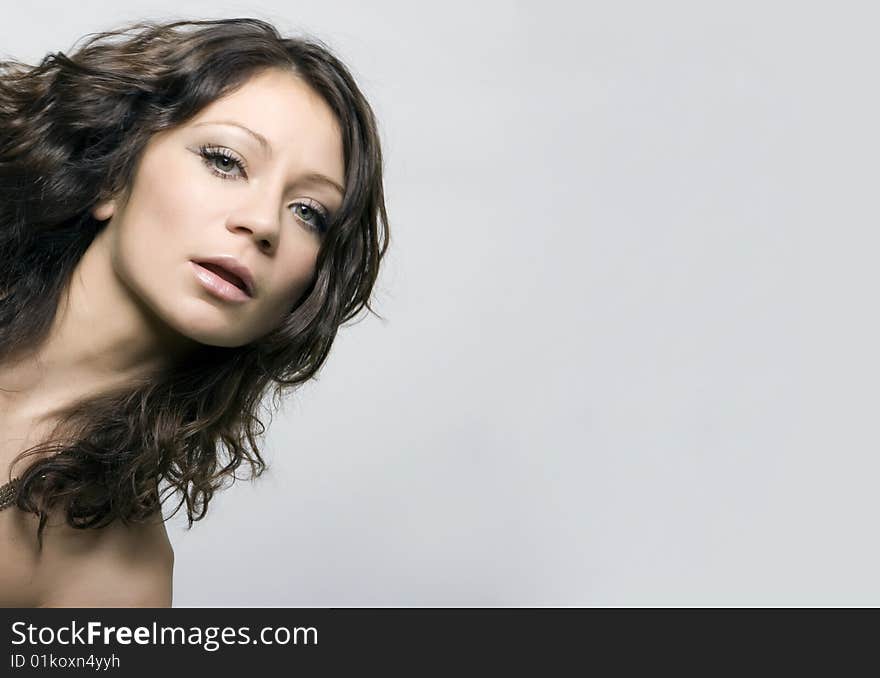 Close-up portrait of a beautiful young brunette. Close-up portrait of a beautiful young brunette