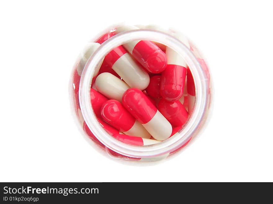 Red-white pills on a white background