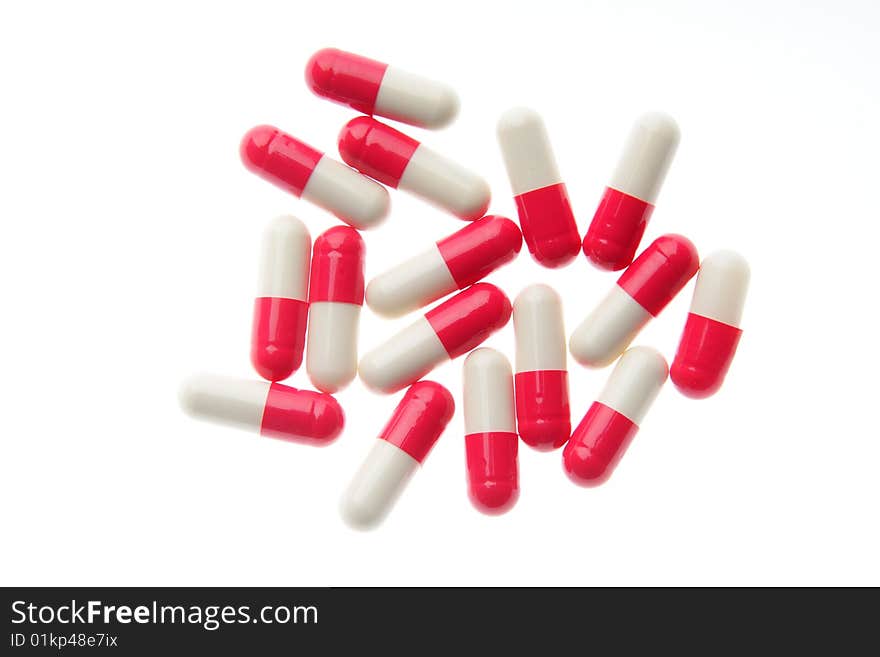 Red-white pills on a white background