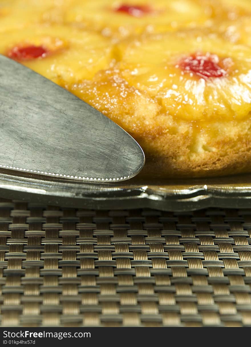 Homemade pineapple cake on a plate focus on the utensil. Homemade pineapple cake on a plate focus on the utensil