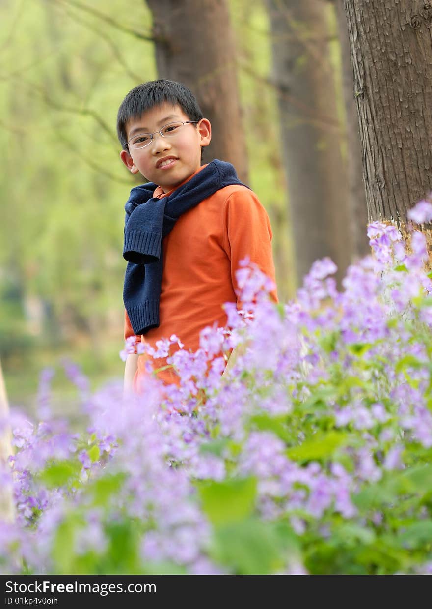 Chinese boy standing in the bloom