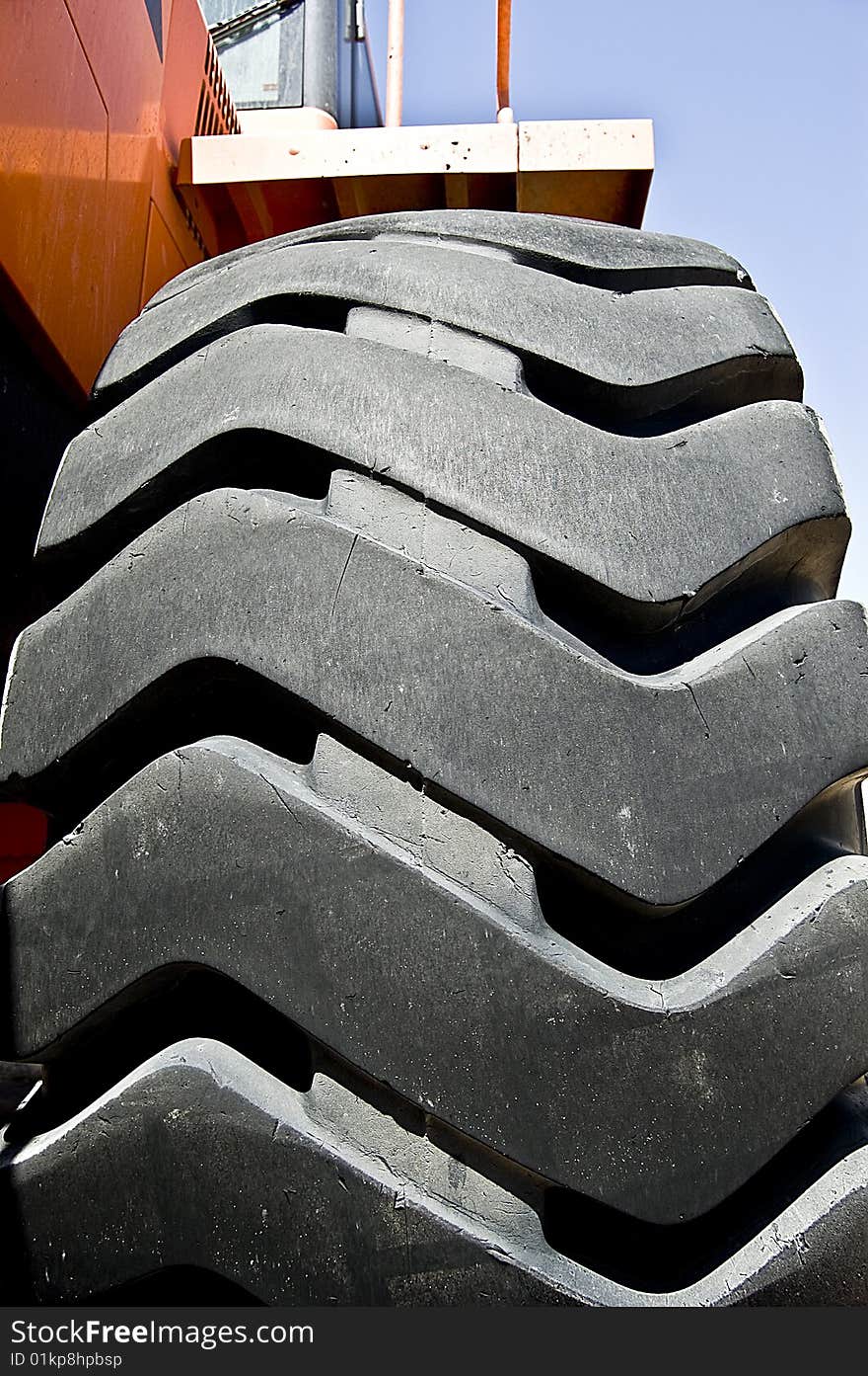 A huge tractor wheel. A view from below.