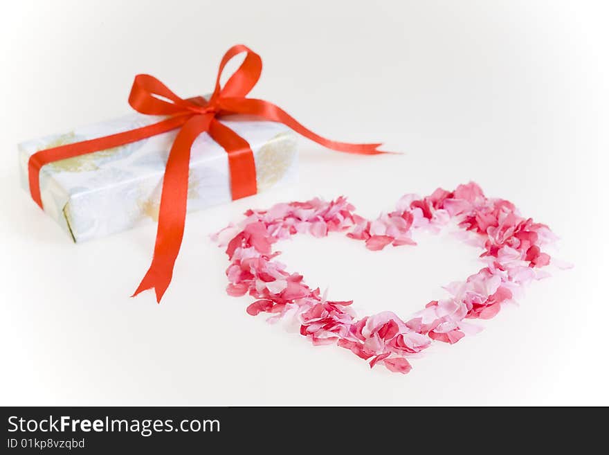 Petals shaped as a heart with gift box.