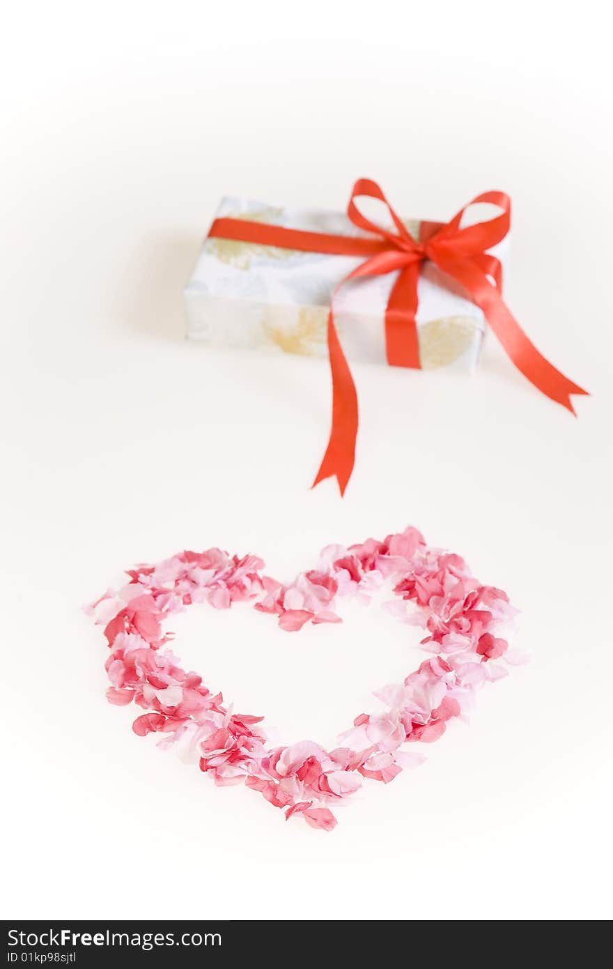 Petals shaped as a heart with gift box.