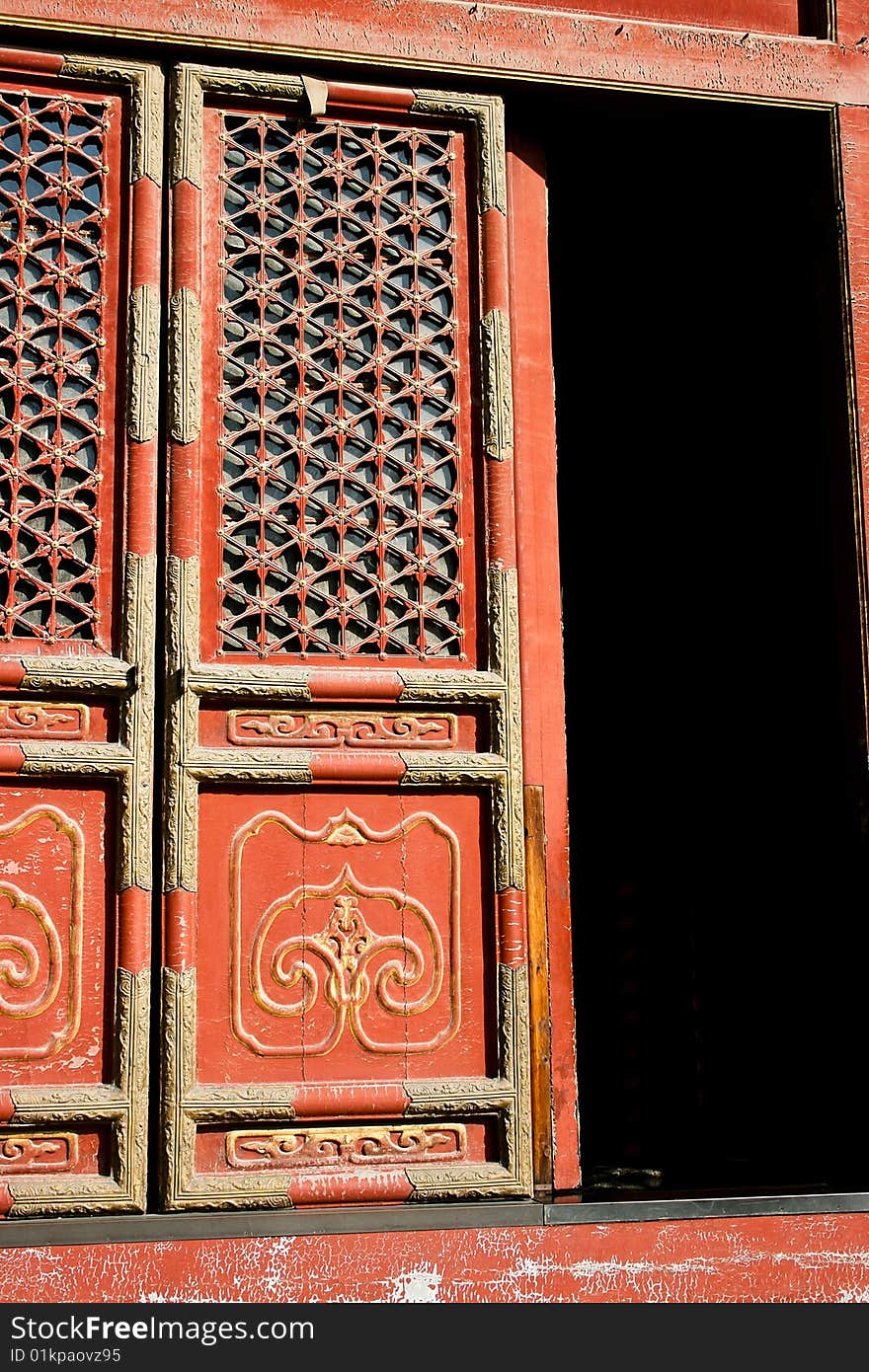 Detail of an ornamented door in a Chinese Buddhist temple in Beijing