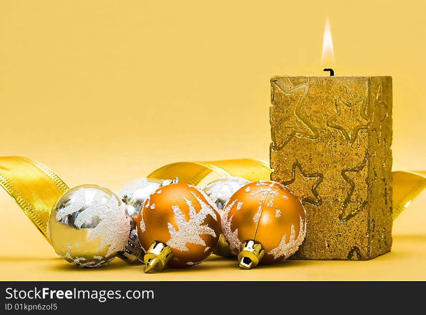 Golden candle and Christmas balls