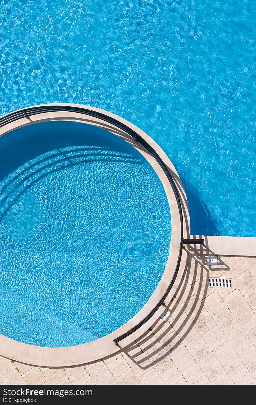 Refreshing in the blue hotel pool. Refreshing in the blue hotel pool