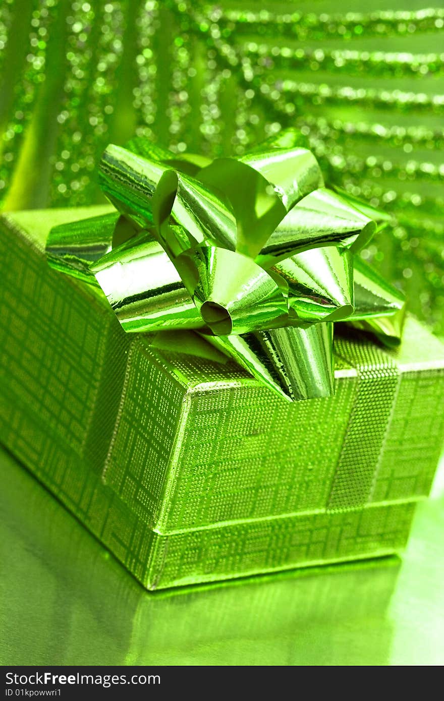 Gift box on green background with leaf