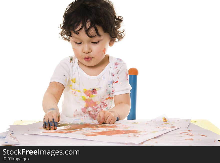 Little boy painting with paints for hands