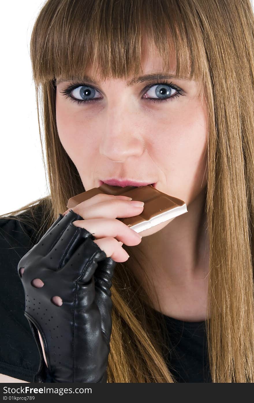 Young girl with chocolate in mouth. Young girl with chocolate in mouth.