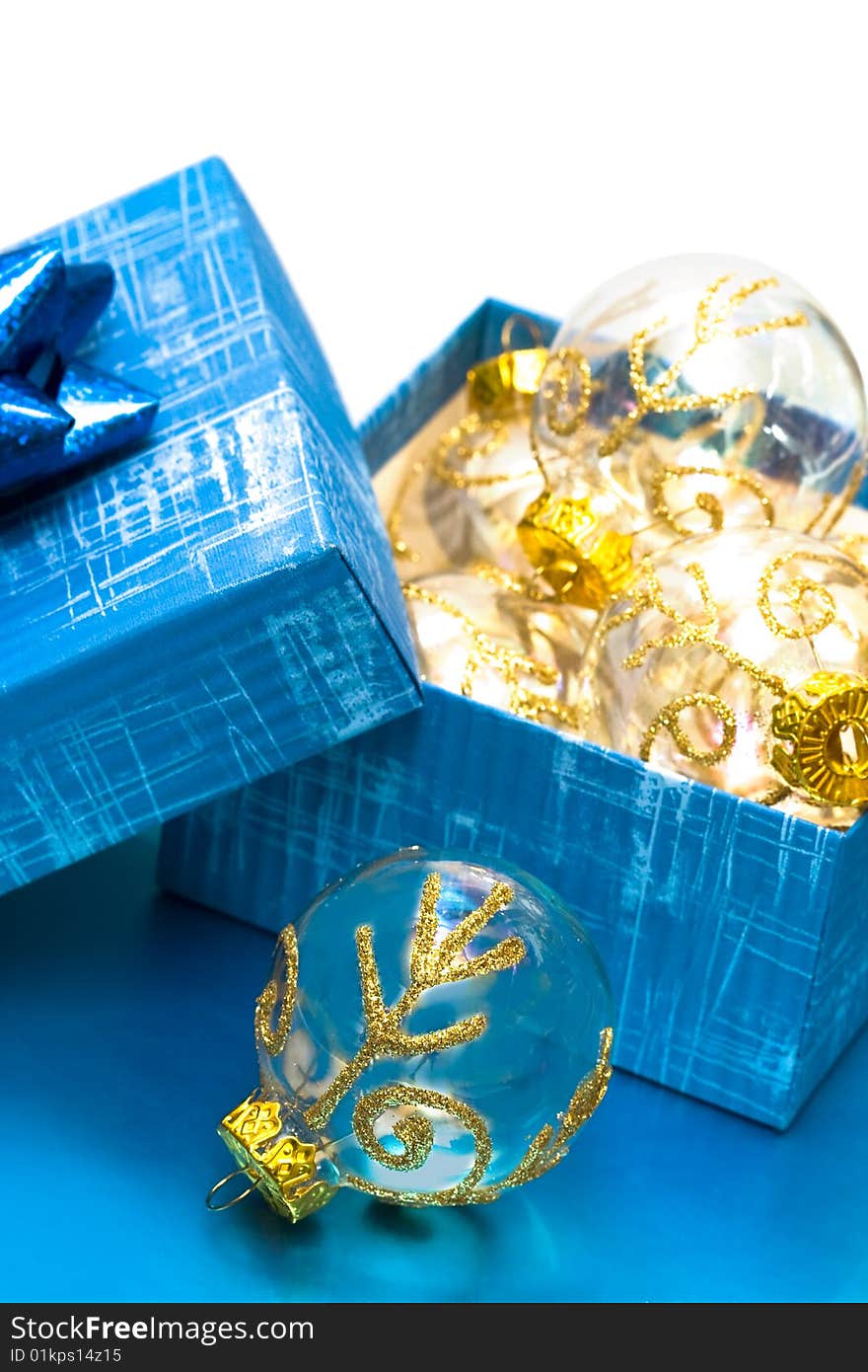 Many Christmas balls in blue gift box