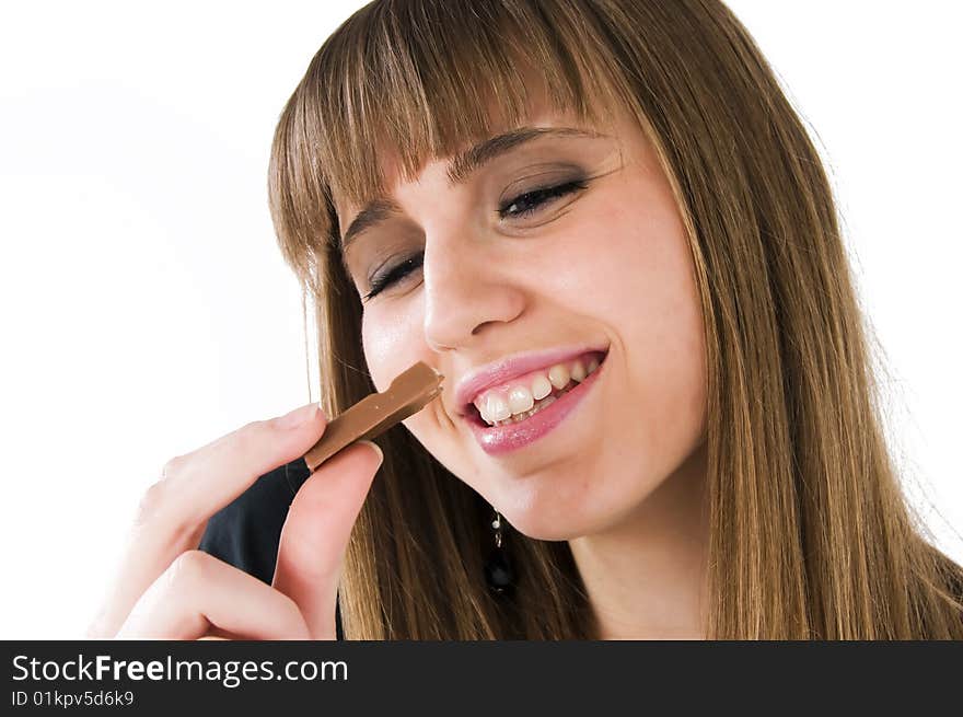 Young girl with chocolate in mouth. Young girl with chocolate in mouth.