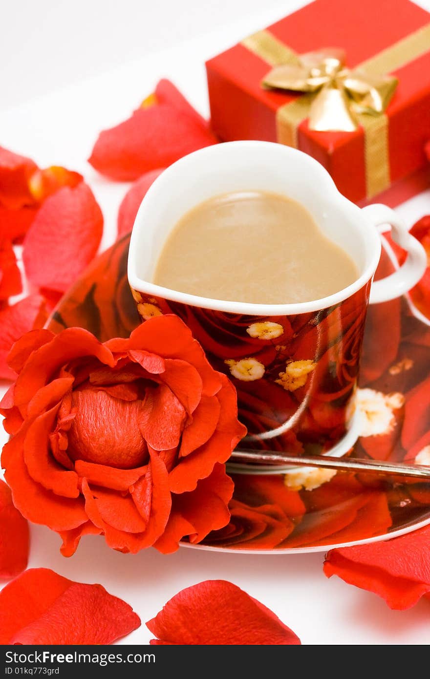 Red cup of coffee with roses