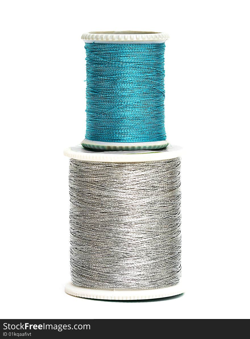 Blue and silver spools of threads