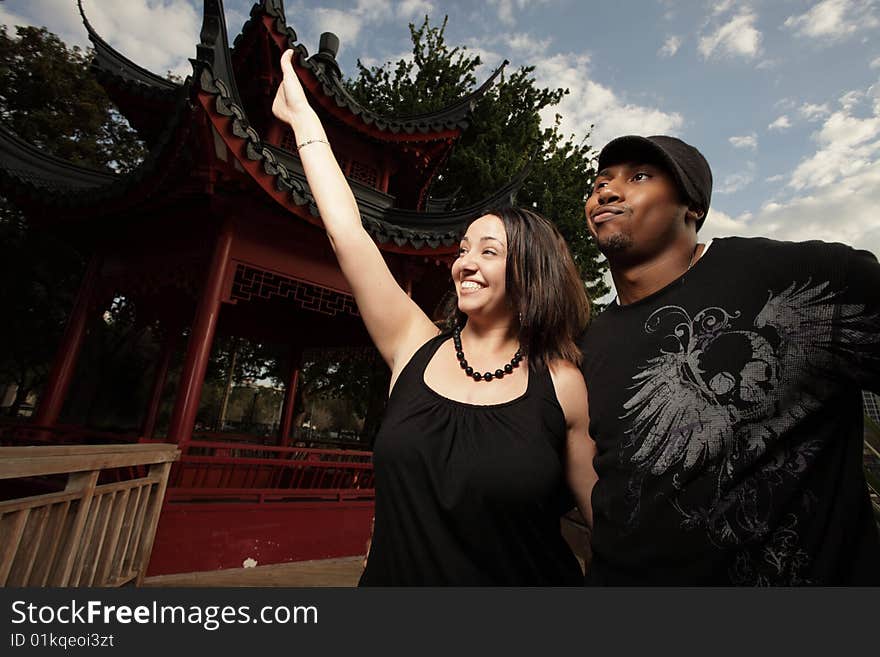 Couple Waving To Their Friends