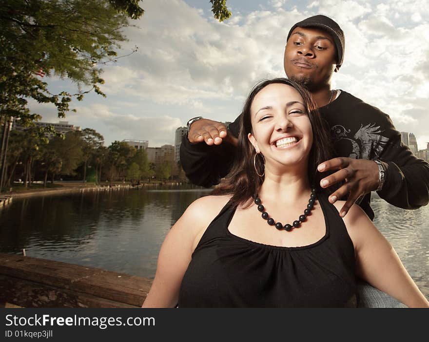 Young woman about to be choked by her angry boyfriend from behind