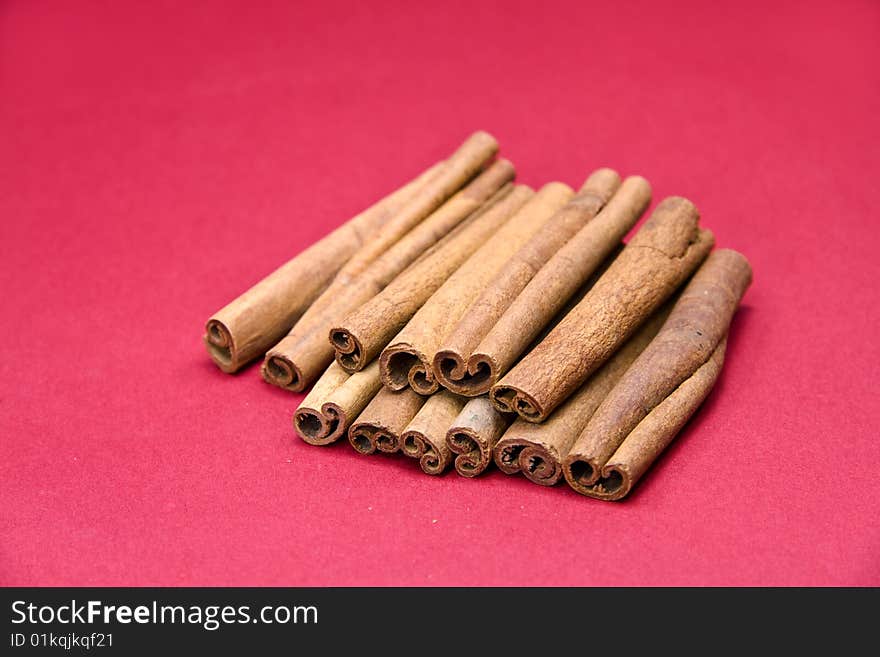 Cinnamon Sticks On Red- Tight Depth Of Field