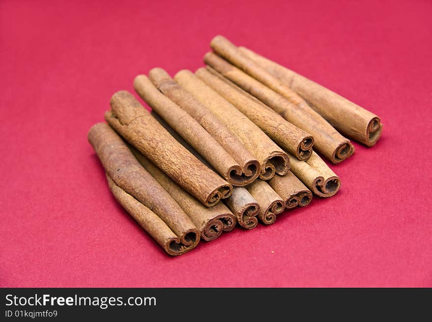 Cinnamon Sticks On Red- Tight Depth Of Field