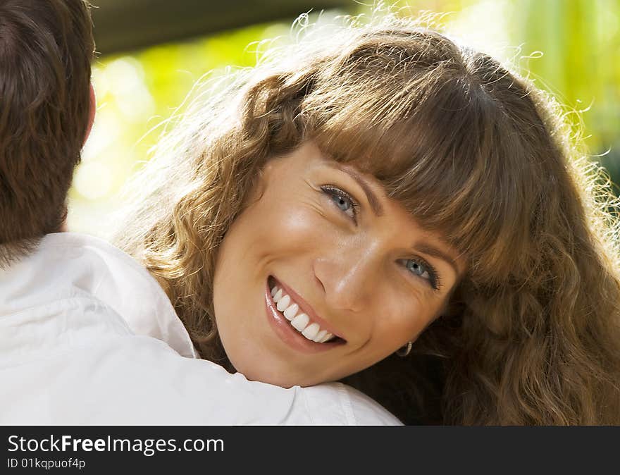 Portrait of young attractive woman having good time in summer environment. Portrait of young attractive woman having good time in summer environment