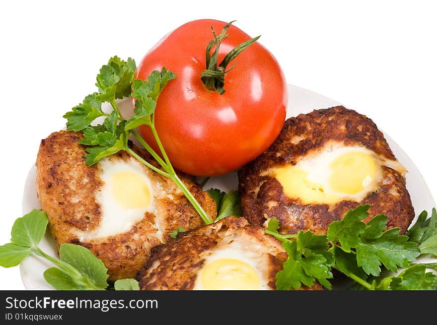 Cutlets and a tomato.