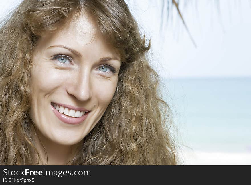 Portrait of nice young woman having good time on the beach. Portrait of nice young woman having good time on the beach