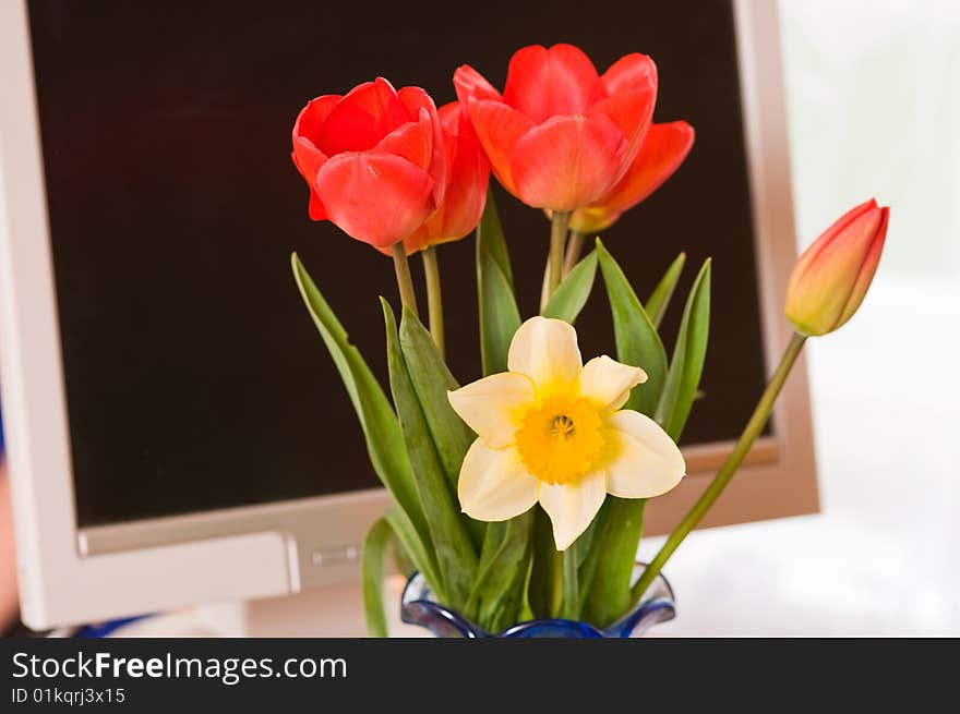 Bouquet against the monitor.