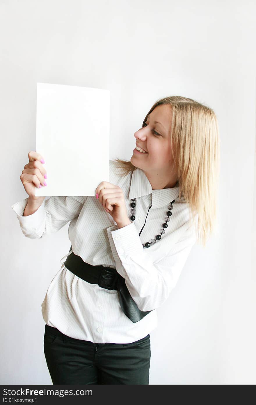 Beautiful young woman holding blank billboard. Beautiful young woman holding blank billboard