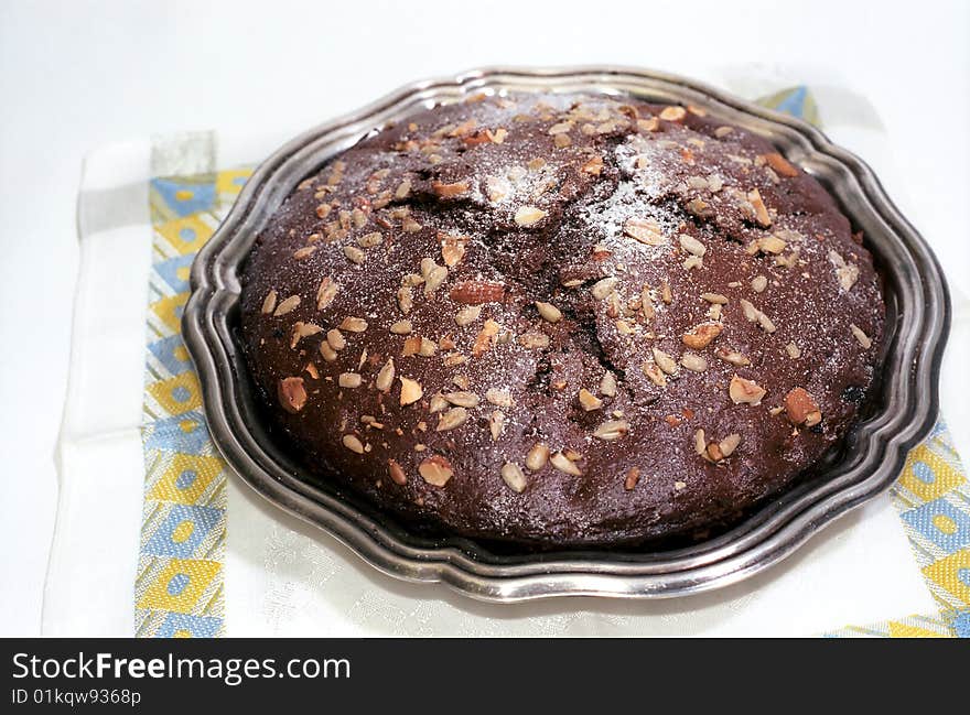 Chocolate cake on table-napkin