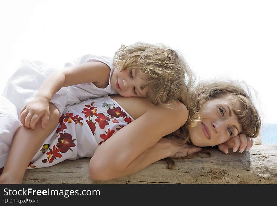 High key portrait of happy mother with baby. High key portrait of happy mother with baby