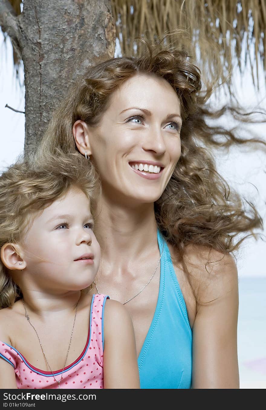 Portrait of  beautiful young woman with her daughter. Portrait of  beautiful young woman with her daughter