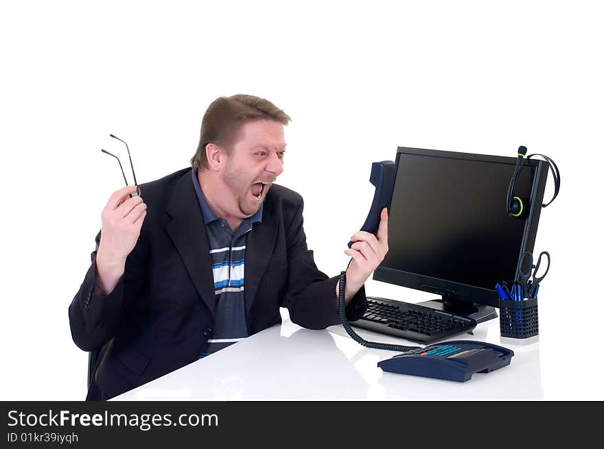 Angry businessman on desk