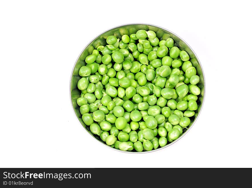 Green peas in bowl isolated on white.