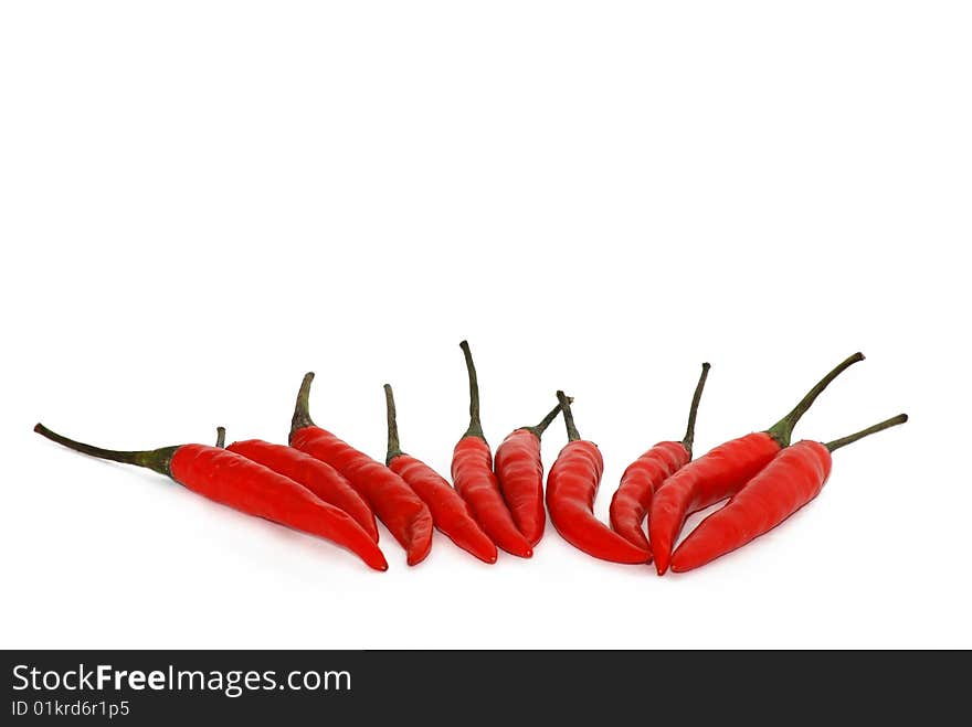 Red chili peppers isolated over white. Red chili peppers isolated over white