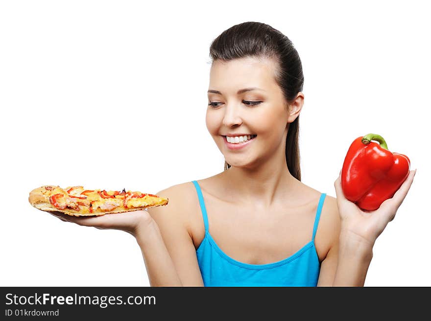 Beautiful young woman with pizza in one hand and red pepper in other one. Beautiful young woman with pizza in one hand and red pepper in other one