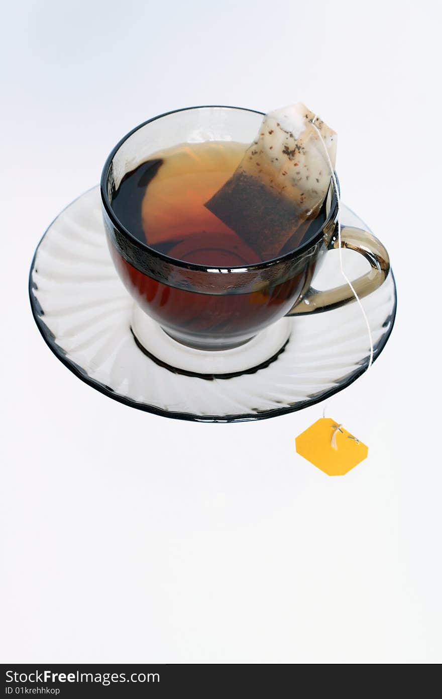 Cup of quick-dissolving tea standing on sauser. Cup of quick-dissolving tea standing on sauser