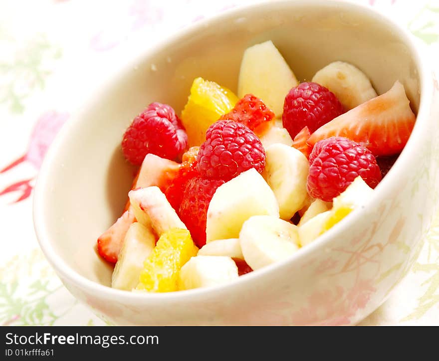 Salad fruit on strawberries oranges and banana and apple in a cup. Salad fruit on strawberries oranges and banana and apple in a cup