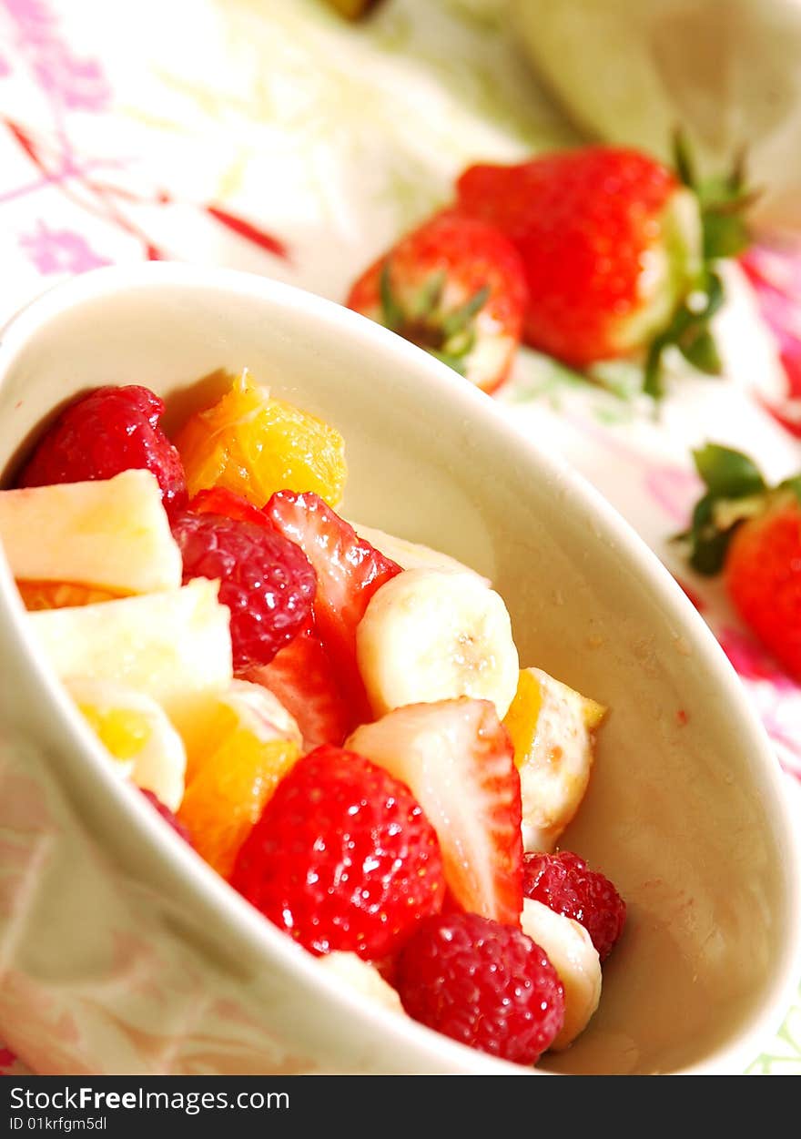 Salad fruit on strawberries oranges and banana and apple in a cup. Salad fruit on strawberries oranges and banana and apple in a cup