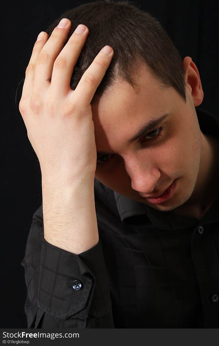 Portrait of serious young man in shirt. Portrait of serious young man in shirt