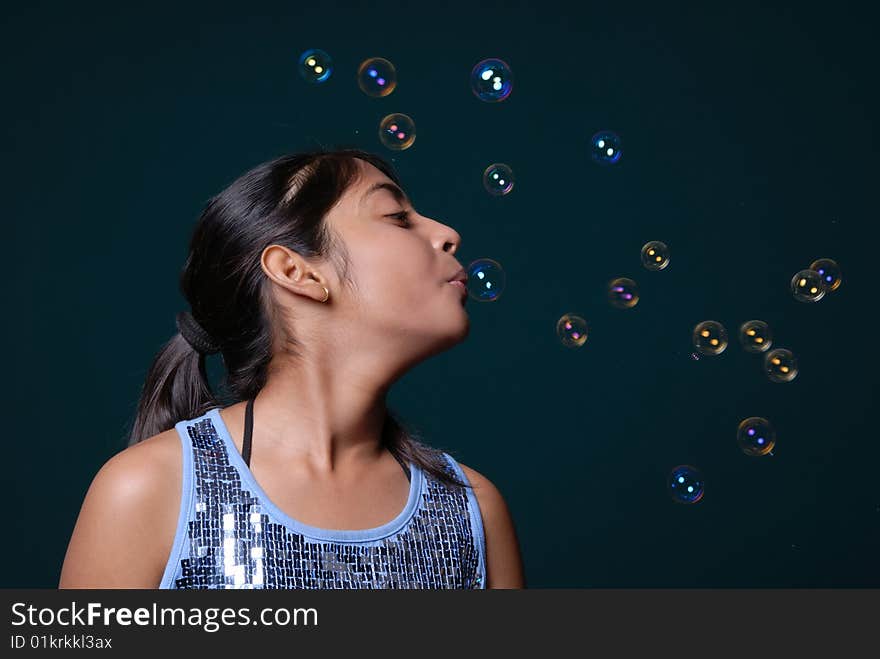 Girl blowing lot of bubble