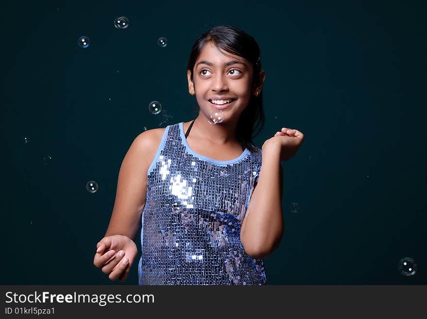 Girl dancing with soap bubbles