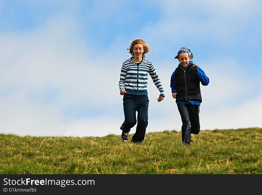 Action shot of girls running down a hill