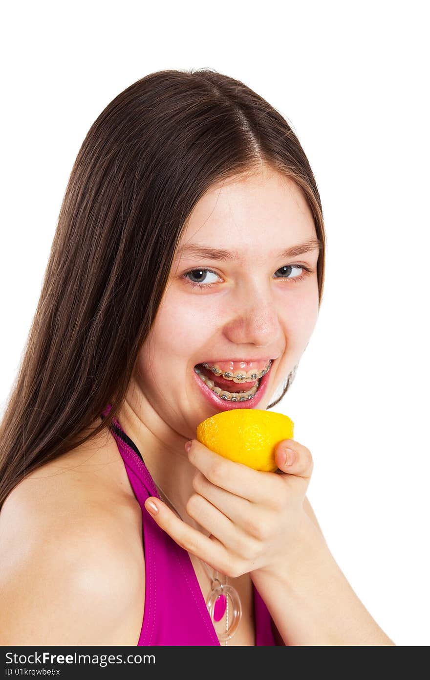 Long hair teen in bikini with piece of lemon. Long hair teen in bikini with piece of lemon