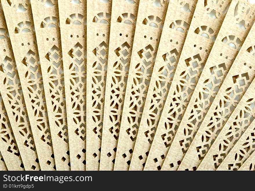 Decorative wooden Japanese fan with ornament