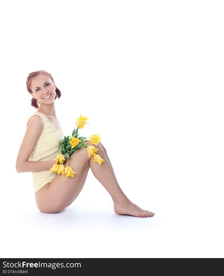 Cute young woman with yellow tulips. Cute young woman with yellow tulips