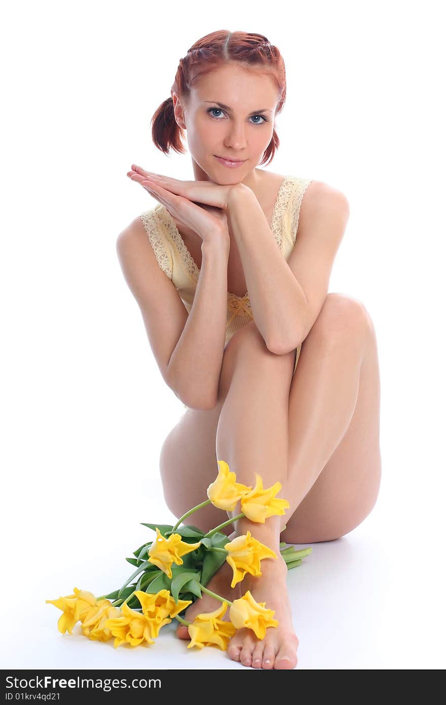 Cute young woman with yellow tulips. Cute young woman with yellow tulips