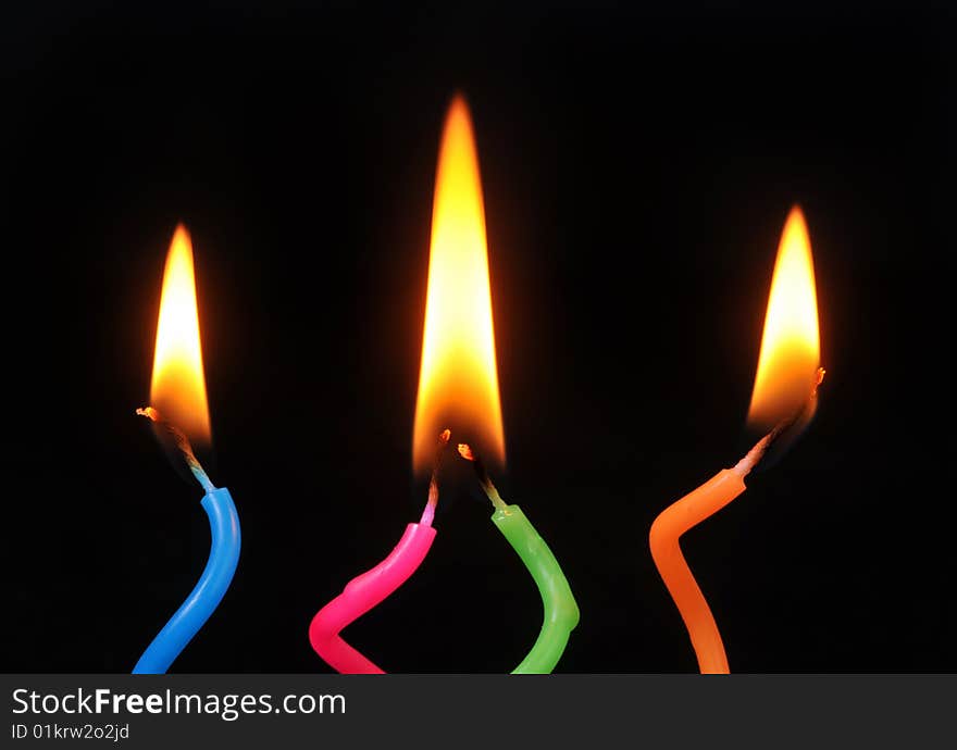 Birthday Candles  Glowing on Black Background.